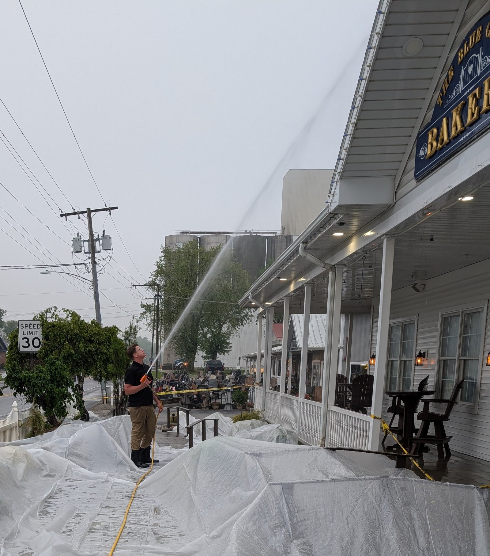 kenneth miller power washing the exterior of the blu gate in shipshewana indiana